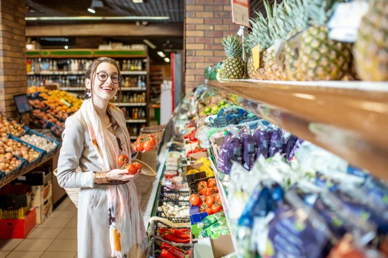 a woman is choosing the food import from the largest grocery wholesale distributors